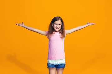 Image showing Happy success teen girl celebrating being a winner. Dynamic energetic image of female model