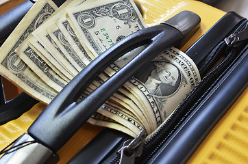 Image showing Suitcase with US Dollar banknotes