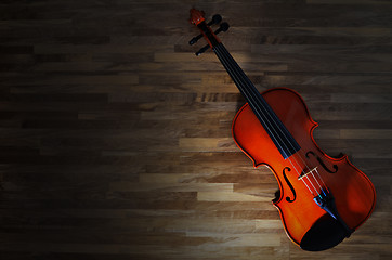 Image showing Violin on rustic wooden background