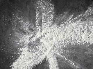 Image showing white flour on black kitchen table