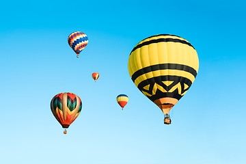 Image showing Colorful hot air balloons in the blue sky