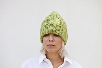 Image showing Beautiful young woman in warm green beanie