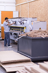 Image showing worker in a factory of wooden furniture