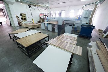 Image showing worker in a factory of wooden furniture