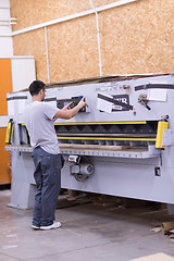 Image showing worker in a factory of wooden furniture