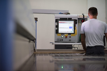 Image showing worker in a factory of wooden furniture