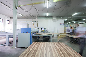 Image showing worker in a factory of wooden furniture