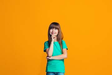 Image showing Young serious thoughtful teen girl. Doubt concept.