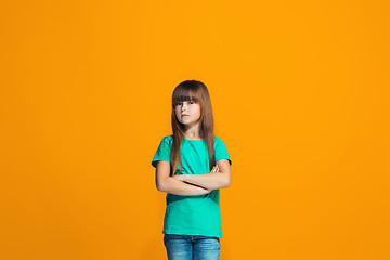 Image showing Young serious thoughtful teen girl. Doubt concept.