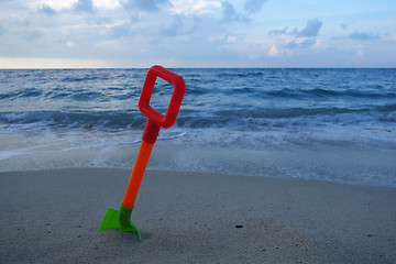 Image showing Toys on the beach sand