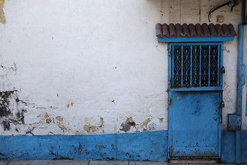 Image showing Old building with interesting blue door