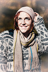 Image showing portrait of a smiling woman in snow