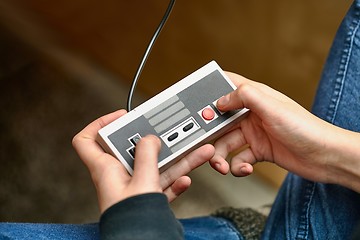 Image showing Playing an old gaming console