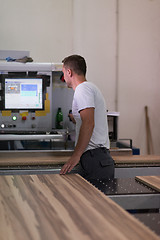 Image showing worker in a factory of wooden furniture