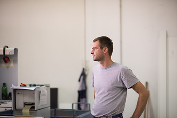 Image showing worker in a factory of wooden furniture