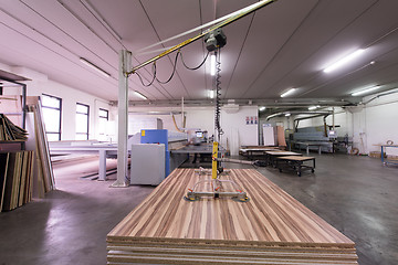 Image showing worker in a factory of wooden furniture