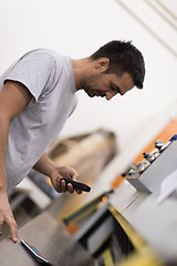 Image showing engineer in front of wood cutting machine