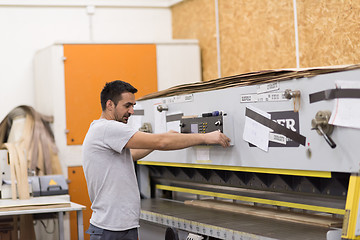 Image showing worker in a factory of wooden furniture