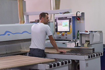 Image showing worker in a factory of wooden furniture