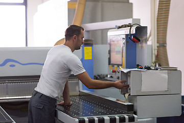 Image showing worker in a factory of wooden furniture