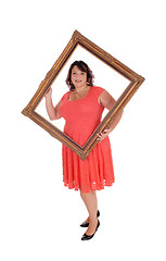 Image showing Big woman holding a picture frame