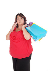 Image showing Overweight woman holding her shopping bag's