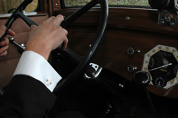 Image showing Driving an old car