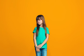 Image showing Young serious thoughtful teen girl. Doubt concept.