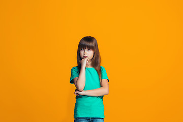 Image showing Young serious thoughtful teen girl. Doubt concept.