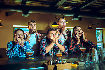 Image showing Sport, people, leisure, friendship and entertainment concept - happy football fans or male friends drinking beer and celebrating victory at bar or pub