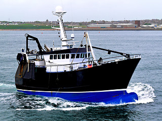 Image showing Fishing Boat Leaving Harbour.