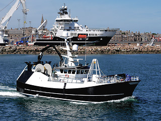 Image showing Fishing Vessel Leaving Harbour.