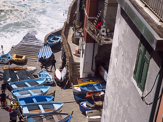 Image showing editorial boats on pavement waterfront Riomaggiore, Cinque Terre