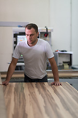 Image showing worker in a factory of wooden furniture