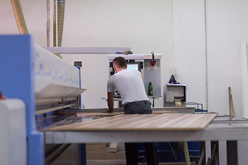 Image showing worker in a factory of wooden furniture