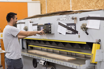 Image showing worker in a factory of wooden furniture