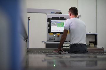 Image showing worker in a factory of wooden furniture