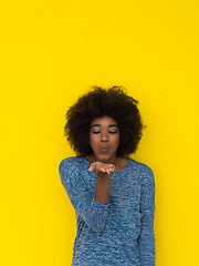 Image showing black woman isolated on a Yellow background