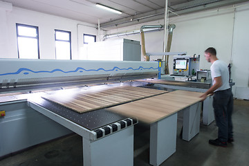 Image showing worker in a factory of wooden furniture