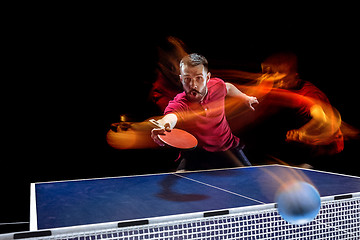 Image showing The table tennis player serving