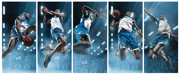 Image showing Basketball player on big professional arena during the game. Basketball player making slam dunk.