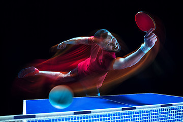 Image showing The table tennis player serving