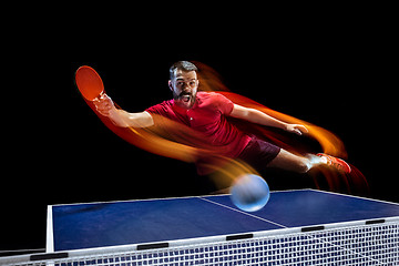 Image showing The table tennis player serving