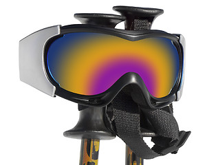 Image showing Close up of the ski goggles on ski sticks isolated on white back