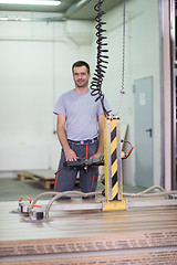 Image showing worker in a factory of wooden furniture