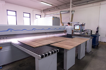 Image showing worker in a factory of wooden furniture