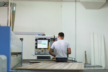 Image showing worker in a factory of wooden furniture