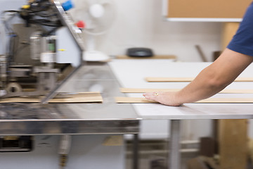 Image showing engineer in front of wood cutting machine