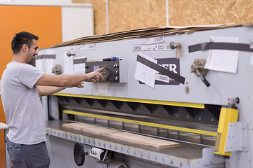 Image showing worker in a factory of wooden furniture