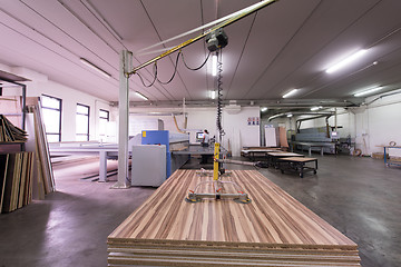 Image showing worker in a factory of wooden furniture